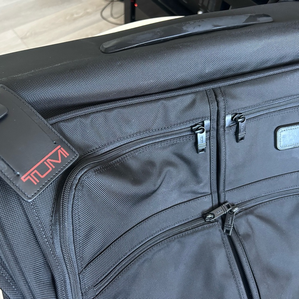 TUMI Black Travel Bag with Red Accents